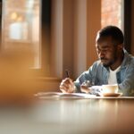 African man working at cafe
